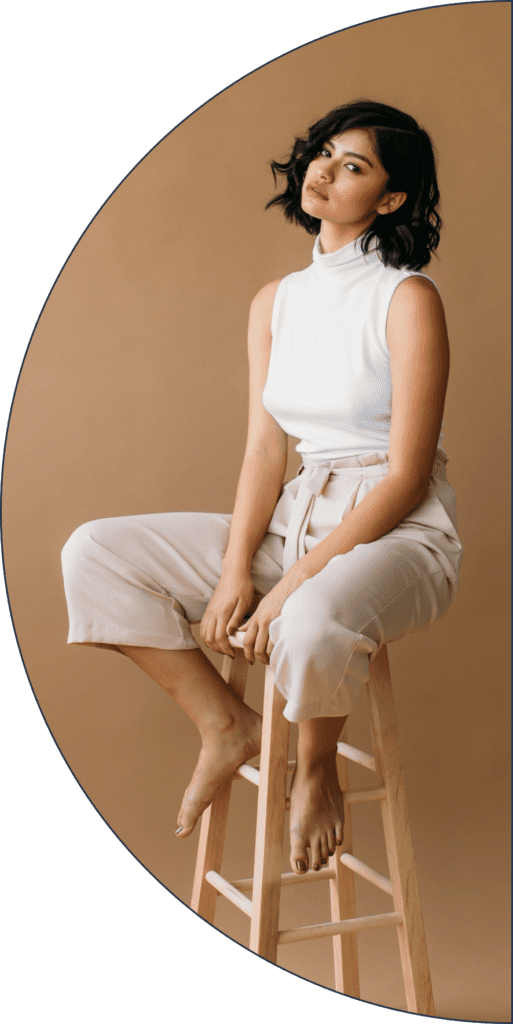 A woman entrepreneur sitting on a chair.