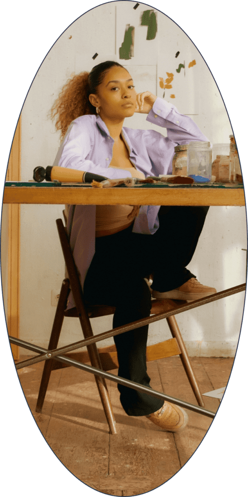 A woman entrepreneur sitting at a desk.
