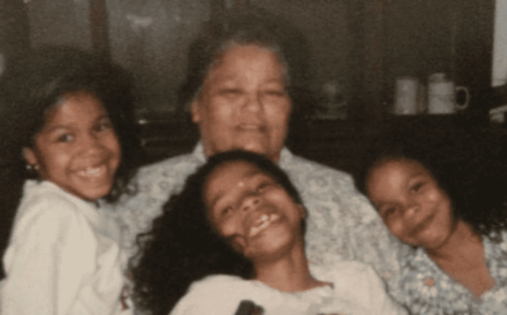 Film picture of three Afro-Latina girls surrounded their mom in the center