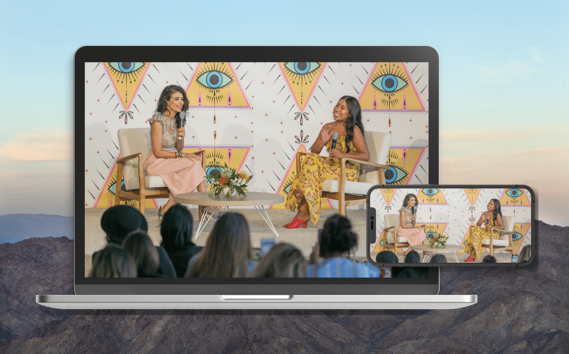 A phone and laptop hold a shot of #WeAllGrow founder and CEO Ana Flores speaking to Yalitza Aparicio at the #WeAllGrow 2019 Summit.