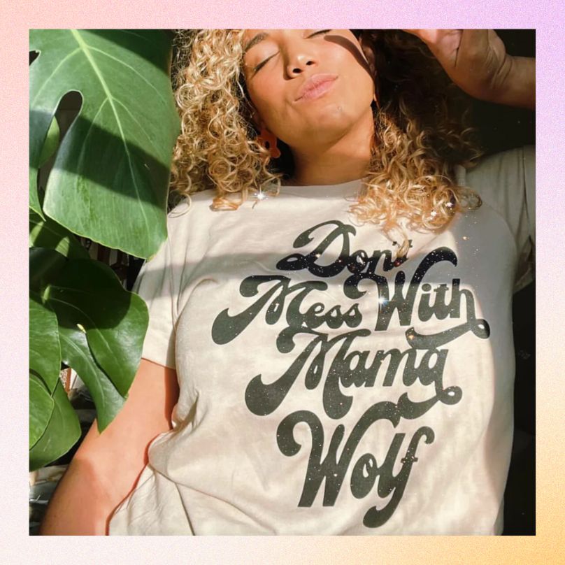 A t-shirt that says. "Don't Mess with Mama Wolf," by Latina brand Her Little Wolves shown as a Mother's day gift.